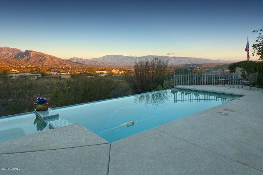 Perched at The Top of a Quiet Cul-De-Sac on The Best Lot on The Ridge at Ventana Canyon, This Quality, Masonry Built Home Will Not Disappoint. 3 Bedrooms & 4 Bathrooms w/ Office - 2860 SqFt. Charming Courtyard Entry, Soaring Ceilings w/Large Windows, Great room w/ Gas Fireplace, Formal Dining Room, Gourmet Kitchen w/Granite Counters, Large Island, & Spacious Eating Area. Second Level Features a Spacious Master Bedroom w/ Commanding Golf  Course & Mountain Views, Spa Like Bath w/ Dual Vanities, Shower, Separate Tub, & a Large Walk in Closet. The Upstairs Also Includes Two Guest Suites w/ Excellent Mountain Views, Each w/ Their Own Private Baths. Expansive Outdoor Living Area w/ Infinity Edge Pool & Spa, Covered Dining area, Citrus Trees, & 180 Degree Mountain & Ventana Canyon Views!!