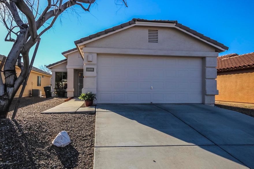 Simply charming!  This home is located in Valencia Reserve and has features you will love!  The beautiful tiled floors, rich cabinetry and pantry create your perfect kitchen.  The dining area adds the finishing touch.  Hardwood floors greet you at the front door as does the custom ''antiqued'' paint palette.  This master suite is complete with a full bath ensuite.  Step outside and take in this low maintenance backyard!  Enjoy an evening meal or morning coffee under this covered patio.  Another uncovered pad is available for a firepit!  This home is priced to sell and will not last!  Put it at the top of your list to see today!