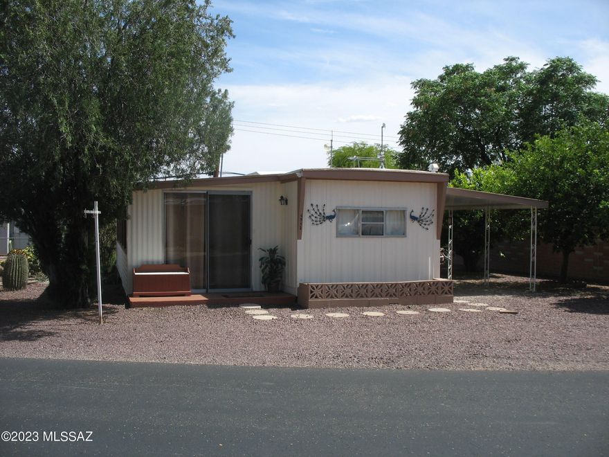 Nice and clean furnished north facing home near Sarasota end of community. East side tiled 10 x 31 AZ room with great mountain views is included in the square footage. Laminate floors inside home with kitchen open to living room. Kitchen has gas range and dishwasher. Wall AC unit in living room. Bath has ceramic tiled floor, vanity, and walk-in shower. Good size master bedroom with built-in closets and drawers. The HOA fee in this 55+ community includes unlimited golf, tennis, pickle ball, shuffleboard, pools, spa, exercise room, trash collection, and much more. You own the land!