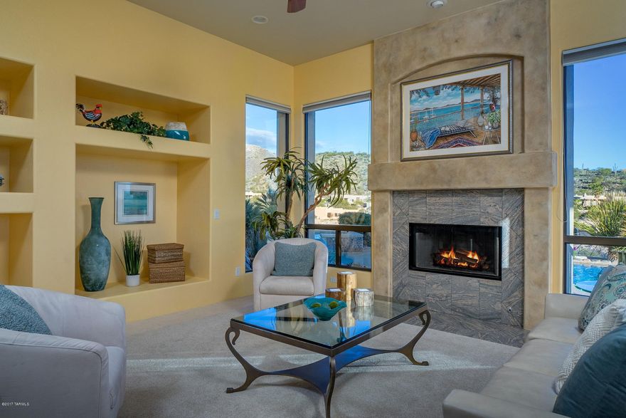 UNPARALLELED MOUNTAIN AND CITY VIEWS IN ALTA VISTA ESTATES!  Bright and open, the high ceilings and many large windows showcase the beauty of this home’s location: magnificent Catalina Mountain views to the North, uninterrupted views of Tucson city lights to the South, and tranquil rolling foothills to the East and West.  This 4BD/3BA split floor plan home features custom faux-painted accent walls, a large covered patio, a salt water pool and spa, and an open kitchen with city views.  Beautiful master suite with fireplace, Jacuzzi tub, walk-in shower, and oversized walk-in closet.