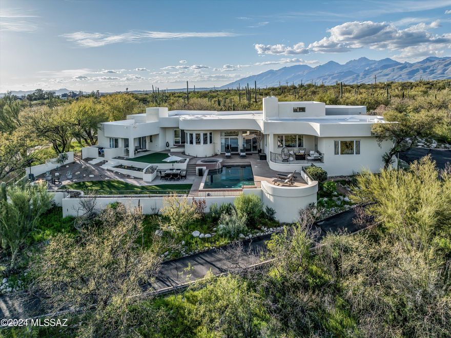 SELLER WILL COUNTER OR ACCEPT OFFERS BETWEEN $1,450,000-1,500,000. Luxurious Desert Living in Coveted La Cebadilla Estates! Discover elegance and sophistication in this contemporary residence nestled within the esteemed La Cebadilla Estates, offering a sprawling 3.6-acre oasis of desert serenity. Surrounded by majestic saguaro-studded mountains and panoramic views, this elevated lot provides the ultimate escape amidst wide-open spaces and endless natural beauty. Enjoy resort-style living with a sparkling Pebble- Tec pool, cascading spa, and cool covered patio—perfect for entertaining. Unwind against the backdrop of sunset skies from the outdoor pergola or cozy up to the outdoor firepit. Enter through the grand foyer and be captivated by soaring ceilings, an elegant chandelier, and... unique architectural features. Light and bright, the living spaces are well defined, including a formal living room with a fireplace, separate family room and formal dining area. The chef's kitchen features a gas cooktop, Subzero refrigerator, quartz countertops, and jaw-dropping views from the breakfast nook. Escape to the primary suite where relaxation begins! Enjoy your coffee and sunrise from the adjacent patio and then retreat to the spa-like primary bathroom, which boasts a garden tub, dual vanities, and two huge walk-in closets. With four bedrooms, three and a half bathrooms, plus an office/den, this home offers ample space! A thoughtfully designed split floor plan with guest quarters, ensures privacy and comfort for all. Additional features, such as tile flooring throughout, modern ceiling fans, and an epoxy-coated three-car garage with ample storage, this home seamlessly blends luxury and practicality for the discerning buyer. Zoned for horses, with access to nearby horse trails and washes, hiking and biking trails, neighborhood lake, golf courses, and a stone's throw from Saguaro National Park East! Immerse yourself in the beauty of the Arizona landscape and call this your new home!