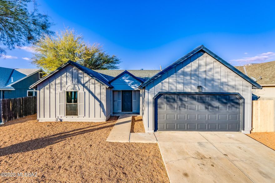 Range priced $290,000-$300,000! Fresh, clean, move-in ready home in well maintained east side subdivision. This home has been lovingly remodeled top to bottom. New roof, new AC, dual pane glass windows, fresh paint inside and out. You will love the updated kitchen with granite counter tops, new lighting. You will marvel at the custom concrete floors and and the very cool, timeless brick fireplace adds character and a cozy lived in feel. The bathrooms have been remodelef and have a spa-like feel. This is a very comfortable home just waiting for a new owner. This hoem has a huge lot and backyard that is a blank slate waiting for you to add your own touch. Freshly landscaped in the front yard with mature trees. Seller is a licensed real estate agent in Arizona