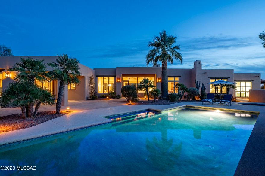 Located in the highly sought after guard gated community of Catalina Foothills 10, set high on a ridge line, with views that stretch out over the Catalina Mountains beyond, while simultaneously nestled within the surrounding natural desert landscape, adding to the feel of this secluded estate. Upon entry, the courtyard features an elongated wraparound veranda that connects the shared living spaces, with a series of glass doors coordinated to tie interior rooms to the spacious outdoor living environments. This exclusive property exemplifies timeless architecture, juxtaposed against modern infused interior updates, with generously proportioned rooms, paired with a thoughtful floor plan that is perfect for both entertaining, as well as casual everyday living. The original design by renowned architect Michael Franks has been reimagined through a series of remodels under the keen eye of Franks and team, retaining the essence of the original architecture, whilst creating a renewed vision of amenities and services an owner would expect from a home of this caliber. Showcasing masterful craftsmanship and exquisite detail, while distributing a delicate balance of intimate and public interior spaces, perfect for winter visitors or families alike.

The updated kitchen features custom millwork, fitting with Wolf and Subzero appliances and cabinetry dressed in satin hardware, surrounding the oversized center island that carefully choreographs the user's movement throughout the space. The owner's suite is sequestered on the West wing of the residence and completely updated in 2021. This award winning design by Debbie Franks features Kursaal white marble tiled walls, with Icon Calacatta marble chevron accents and shimmering pearl glass mosaic ceiling tiles. The centerpiece of the primary bathroom is the Oceano Milano tub that perfectly frames the highly coveted Catalina Mountain view.

As one travels between the individual spaces, dramatic landscapes unfold at every turn, blurring the lines between the indoor and out. Exterior living spaces connect seamlessly, each having been thoughtfully positioned on a North South axis, with views looking out over the resort-like pool and spa, both elegantly and effortlessly situated within the space. Walkways meander through the gardens onto a series of patios, each offering the perfect environment for watching the evening sunsets frame the distant skyline.