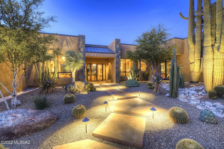Once in a while you come across a home that is so exceptional, yet has an imperfection.  (See remarks for explanation)
A property nestled against a backdrop of the mountains and embracing the serenity of the desert at every turn. The courtyard is graced by years old saguaros. In fact the home was designed in a way as to not disturb these grand giants. Picture warm woods, touches of slate,, and a plethora of windows and patios that creates that feeling of indoor-outdoor living.  The gourmet kitchen was designed to be both a chefs dream and and an inviting place to gather.  Fabulous master suite with an equally fabulous bathroom.  An office sanctuary, bedroom wing, and even another bedroom and bath tucked away.  Lap pool, spa, and soothing waterfall are just as they should be. more.. Large patios can accomodate a group or jitust perfect for that first cup of coffee or a glass of wine by the fireplace. A rare opportunity. 
NOTE:Seller very sensitive to mold so after closing chose to have additional testing done. Seller was told that  mold found can be remediated, however it is buyers responsibility to perform any inspections during due dillegence and make their own determinations.   My seller has chosen to sell the home at a greatly reduced price rather then be involved in remediation or repairs.