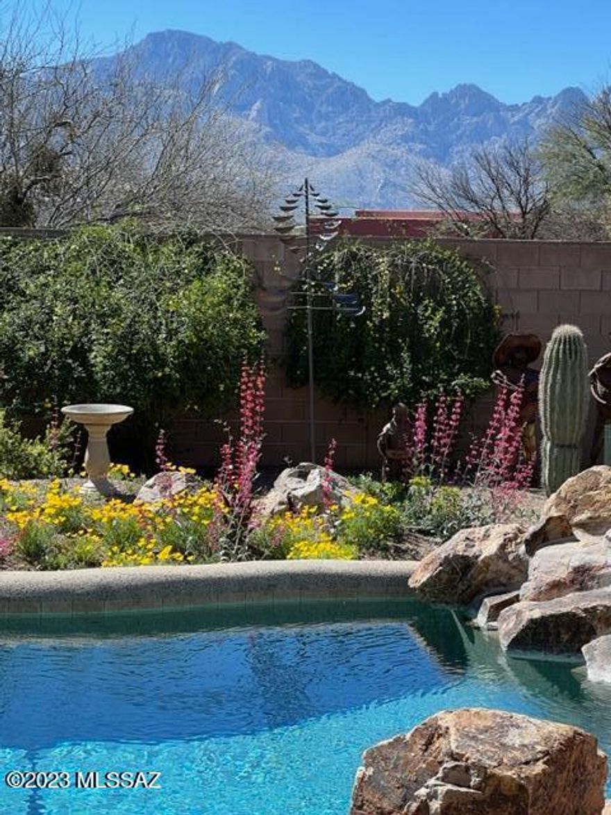 Beautiful custom home with mountain views and privacy! Country living just minutes to shopping/dining and medical. PAVED road to home on a quiet cul-de-sac in a lovely neighborhood enclave of custom homes. Gated driveway. 3 car garage. 4 bedrooms and den (split bedroom plan). Beautiful views can be seen throughout the home from the huge picturesque windows. Relax on cool days/evenings in the den by the cozy gas fireplace. Beautiful, relaxing and private backyard with pool and spa. Gorgeous knotty alder kitchen cabinets, granite countertops and stainless steel appliances. Leased solar thru Tesla. Heater is for Spa.  Pool is saltwater.