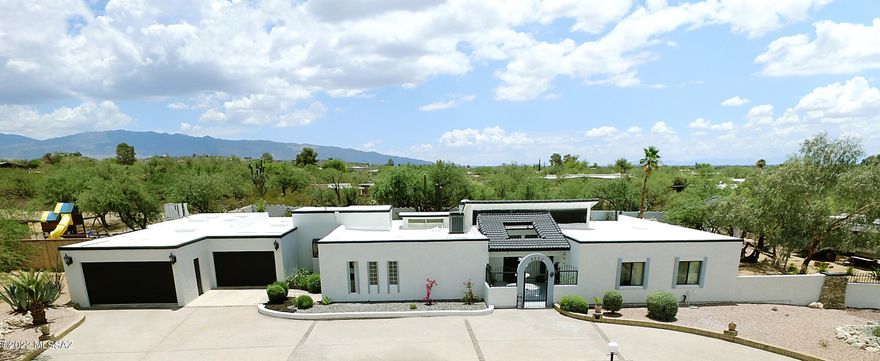 This Arizona home feels like a resort with a large fully remodeled pool and filtration system. The lush backyard offers ponds, waterfalls, and multiple custom flower beds. The stunning rock architecture weaves in and out of this property creating a unique earthly environment. The backyard features a chicken coop and six raised garden beds. The side yard has a 50amp power hookup for an RV. The house has been remodeled to include a new rebuilt roof, three complete upgraded bathrooms, custom flooring, new hot water heater and much more. The mutiple skylights and panoramic windows compliment the spacious open floor plan. The gourmet kitchen features Kenmore Pro appliances with dual ovens. With nearby hiking trails and gorgeous mountain views this stunning home is one of a kind.