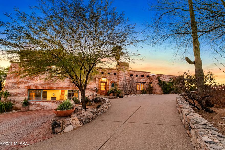 BURNT ADOBE CLASSIC ON 4.38 VIEW ACRES IN THE MOST PRIVATE/QUIET AREA OF THE CLOSE IN ''OLD'' CATALINA FOOTHILLS. This Tucson Territorial offers the best of our Southern Arizona lifestyle - a totally charming 5BR/4.5BA (4181 SQF) home with the classic finishes and details that you will love -Mexican Tile/Concrete/Flagstone floors, hi-beamed wood plank ceilings, hand carved doors, and a stone fireplace to name a few. Built in 1940, the current owners have maintained beautifully, and skillfully  enlarged and modernized the kitchen to today's open and spacious concept. The views from every window are wonderful. Spacious Living/Dining areas plus a Great Room. Outside, a large covered patio, grassy play yard, cozy corner fireplace, and a pool with its own magnificent views. Own. Lic. AZ RE Agt.