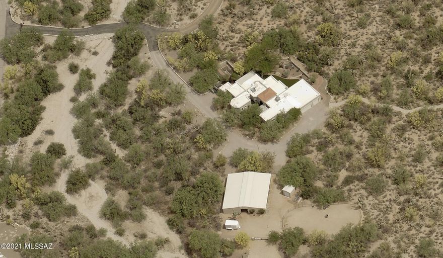 Tanque Verde Valley - Majestic Mountain View Property, with well appointed contemporary Santa Fe style home and modern horse facilities on 3.36 AC.  Iron entry gate with stone columns and long driveway constructed of show quality custom rock work.  Lush desert greenery surrounds this one of a kind home, located east of Catalina Highway along Snyder Rd. Don't miss this opportunity!
