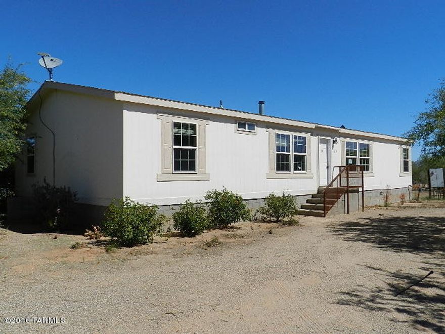 Amazing horse property! Over 4 acre parcel features 6 stalls, tack & storage, Horse Arena plus detached 3 car garage. The home offers split floor plan with 3 bedroom/2 bath, cozy fireplace in living room, spacious kitchen with plenty of cabinet space & island. Master bath has garden tub, dual sinks and separate shower. Come see it today!