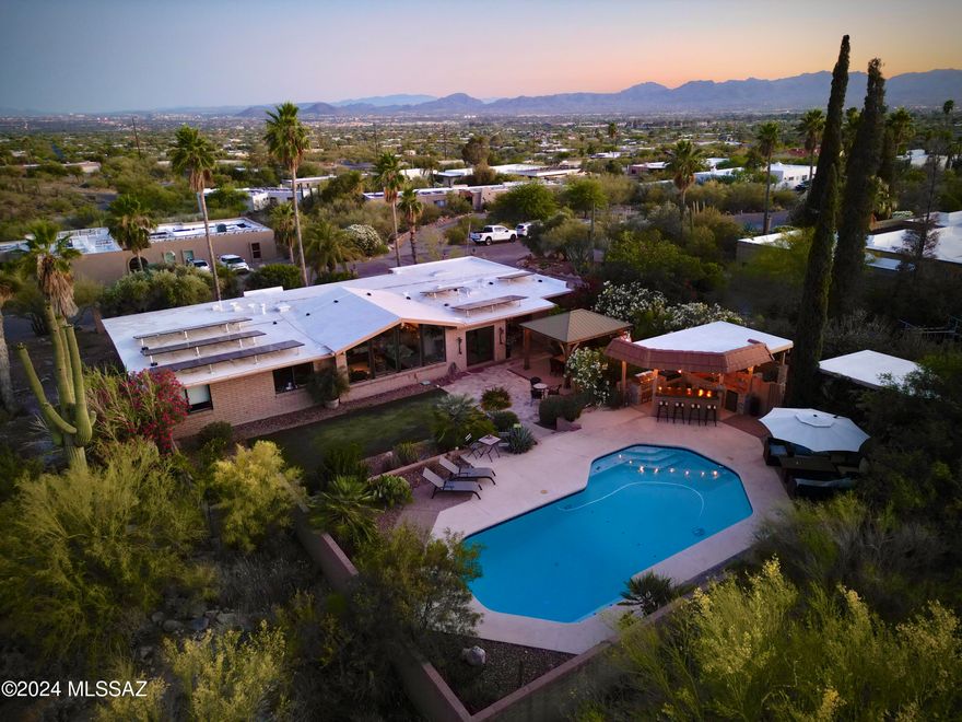 Welcome to your dream home nestled in the prestigious Catalina Foothills of Tucson! This stunning property offers remarkable mountain views that will take your breath away, all from the comfort of your entertainer's backyard. Imagine hosting unforgettable gatherings with friends and family as you take in the panoramic vistas of the majestic Catalina Mountains. Step inside to discover a beautifully remodeled kitchen, designed with the modern entertainer in mind. Featuring top-of-the-line appliances, sleek countertops, and ample storage, this kitchen is both functional and stylish, perfect for preparing gourmet meals or casual snacks. The open floor plan flows seamlessly into the spacious living and dining areas, making it easy to entertain guests while enjoying the stunning views large picture windows. The bathrooms have also been meticulously updated, offering a spa-like retreat with luxurious finishes and fixtures. Each detail has been carefully selected to provide comfort and elegance, creating a serene oasis for you and your guests. Outside, the backyard is a true entertainer's paradise. With multiple seating areas, a built-in barbecue, and a sparkling pool, this space is designed for hosting everything from intimate gatherings to large celebrations. Enjoy the tranquility of the desert landscape and the ever-changing colors of the mountains as the sunsets. This Catalina Foothills gem combines luxury, comfort, and unbeatable views, making it the perfect place to call home. Don't miss the opportunity to experience this exceptional property for yourself.