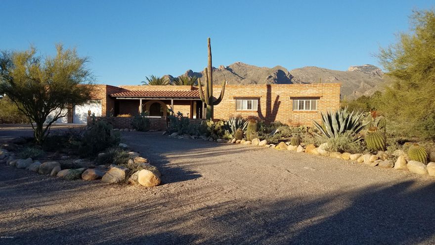 Wonderful 4 bedroom house with split floor plan. Two bedrooms with ensuite bathrooms. Living room, dining room, family room, and breakfast area. Views of the Catalina Mountains to north from most of the house. Large covered patios, private custom spool with gas heat and automation. Saltillo tile in main living areas with new carpets in all bedrooms.  House is located in a quiet area of the Foothills with no road noise.  Parking for large RV on site-no hookups.