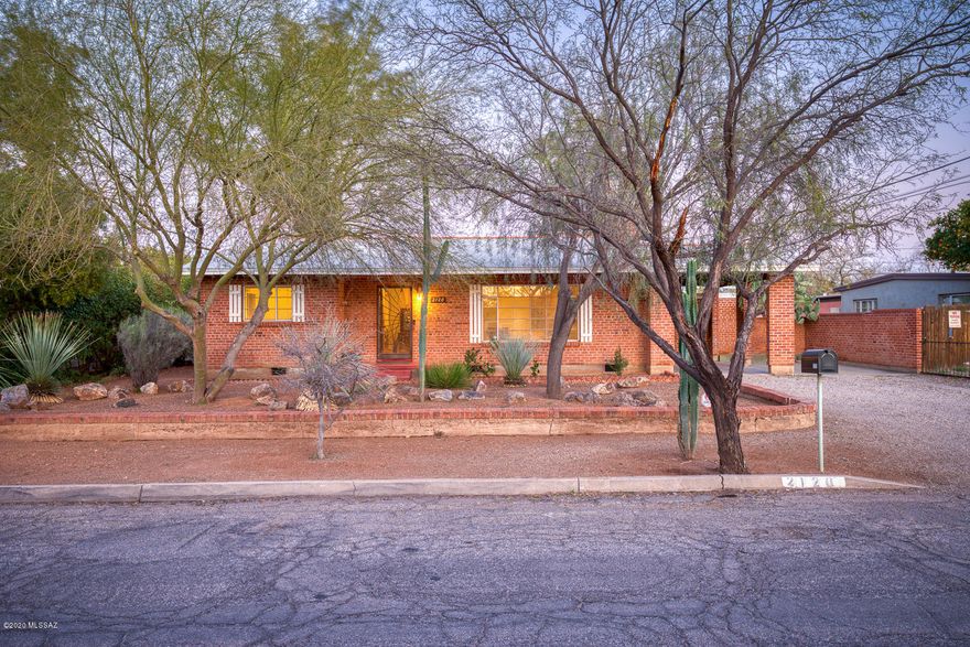Classic wire cut brick ranch home in the historic Catalina Vista neighborhood. Updated and beautifully maintained. Hardwood and polished concrete floors. 2 great living spaces on opposite sides of the home. 3 beds with updated baths that show off period tiles. Granite counters and stainless/black appliances in kitchen. Updated laundry facility on property. Large, private back yard is perfect for entertaining. Great central location close to UofA and Banner Medical Center. Walking distance to Culinary Dropout, Postino and Snooze. This property has a historic tax designation.