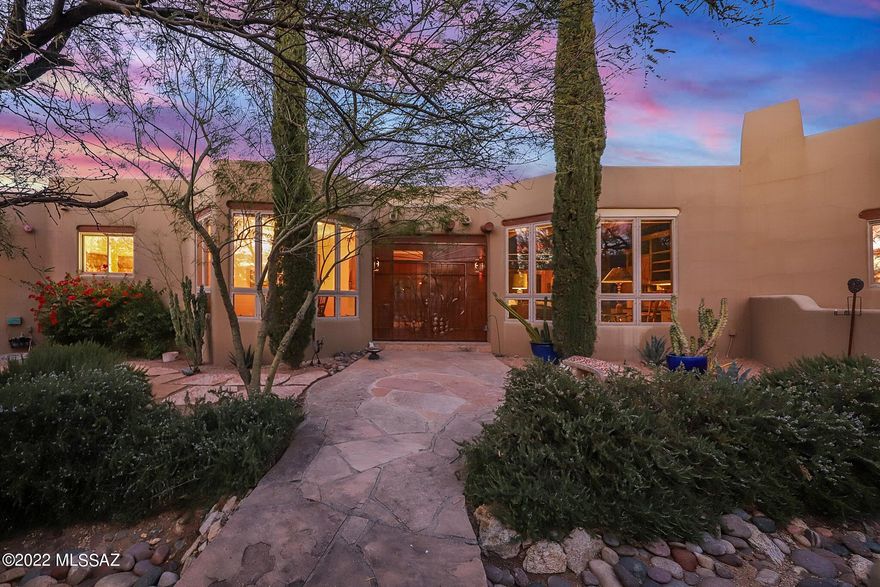 Outstanding Santa Fe style home on 3.3 acre property in Tanque Verde Valley. Built in 1994, this stunning 4 bedroom 3.5 bath is sure to impress. Boasting a great room, formal dining, family room & an additional 412 sq/ft activity room w/ mini-split. This home has outstanding SW style that includes Viga Beams, latilla ceilings, Saltillo tile, Talavera tile & premium paint throughout. Full length back porch splits into two outdoor living spaces, one w/ a fireplace w/ seating & the other w/ an outdoor kitchen. With a meandering walkway that winds around the entire yard showcasing the Ocotillo fence-line, the views from the backyard are captivating. A natural desert landscape, complete with hardwired lighting, Pebble-tec pool, Jacuzzi, waterfall, & outdoor shower, this home is a must see 12555 E Thunderbird Trail
Built in 1994

-3.3 acre lot/144,183 sq/ft
-3377 sq/ft 4 Bedrooms/3.5 Bathrooms
-New front courtyard gate
-Great Room, Family room, Formal & Casual Dining area.
-Laundry room with washer, dryer, hand sink and storage.
-412 sq/ft Activity room- 3 walls of shelves, a large desk & amazing mountain views
-Chef's kitchen w/granite, breakfast bar, prep sink, gas cooktop & double ovens
-Washer, Dryer and Handsink w/storage
-Oversize 3 car garage w/pavered drive, ornate doors, workshop, extra storage along with a service door to backyard.
-2 huge rear porches:
-1st porch has a kitchen set-up w/2 new grills & access to activity room and family room.
-2nd porch has gas fireplace, huge seating area and access to primary & Great room.
-Pebble-tec pool, spa, waterfall and outdoor shower.
-Meandering Flagstone pathways through-out yard with numerous seated areas, an ocotillo lined fence along with rustic outdoor shade spots.
-Updated yard lighting to include pathways, transformers & irrigation system.
-New log assemblies in all 3 fireplaces, new iron screens in Primary & Great room fireplaces. 
-Roof re-coat 3/2022 w/7-year transferrable warranty.
-Sentricon Termite System