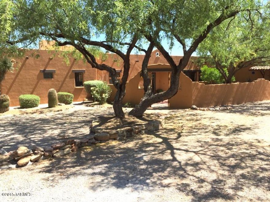 Exceptional home on fabulous 1 acre lot with panoramic views. Shows like a model with many upgrades. Open and airy plan allows lots of natural light with lg windows to maximize views. Saltillo floors, beamed ceilings, tile counters  and a traditional cozy fireplace add warmth and charm. Recently remodeled kitchen has top line appliances, breakfast bar and handy computer area. Roomy owners suite. Big 4th bedroom with separate entrance and attached full bath makes great guest quarters. Large walled courtyard with fountain and covered sitting area. Listing agent related to seller.