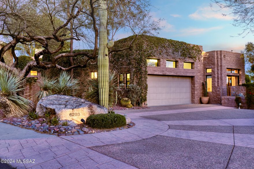 Nestled within the exclusive gated community of Ventana Canyon Country Club, this remarkable residence embodies luxury living at its finest. Designed by renowned architect Ron Robinette, the home boasts an impressive entry that sets the tone for the exquisite interior. Step into the fabulous great room, adorned with soaring 25-foot ceilings, creating an atmosphere of grandeur and elegance. With 3 substantial ensuite bedrooms and a library/office, each offering its own private patio retreat, this home effortlessly blends comfort and sophistication. Entertain guests in style with a formal dining area or gather in the spacious gourmet eat-in kitchen, perfect for culinary delights and casual gatherings alike. The primary suite is a true sanctuary, featuring expansive closets, (continued..) dual showers (including a luxurious steam shower), a generous tub, and direct access to a private outdoor spa, providing the ultimate in relaxation and rejuvenation. Outside, the main rear yard beckons with an inviting swimming pool, offering panoramic views of the lush golf course and majestic surrounding mountains. Experience unparalleled luxury and tranquility in this exceptional desert oasis.