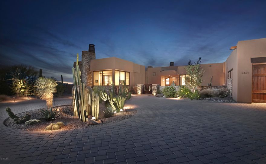 Drastic Price Reduction & now PRICED TO SELL! Managed, serviced & branded by The Ritz-Carlton, life here is a permanent vacation at a 5 Star Luxury Golf Resort in a desert setting unmatched in the Southwest. This spacious one level 3 bedroom + den/4ba home was designed for entertaining & features a large living room w/gas fireplace & exposed beams, retractable walls of glass, a wet bar w/Onyx countertops, hardwood flooring, a walk in wine cellar & a true gourmet kitchen w/Wolf appliances, granite counters & custom cabinets. The rear terrace features a gas firepit w/Banco sitting, built in grill, rolling automatic shades & the most magnificent sunsets. The spacious 1br/1ba guest house completes the package . Ideal for a luxury seasonal, vacation or year round residence.