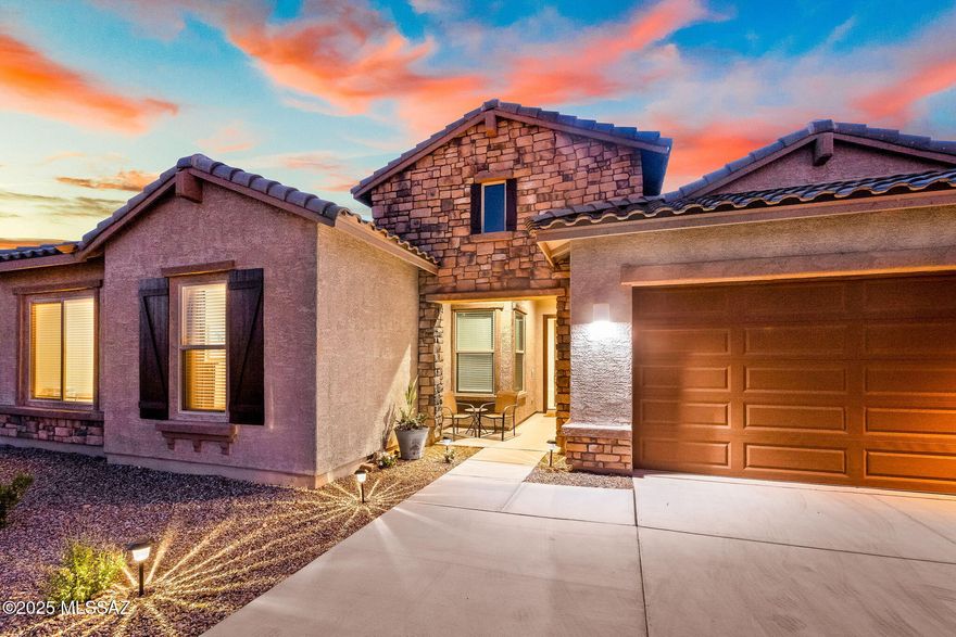 Modern elegance meets relaxed desert living in this beautifully upgraded contemporary ranch-style home, set on an expansive lot in one of Marana's fastest-growing areas. Designed for comfort and style, this home features designer finishes, energy-efficient upgrades, and thousands in improvements throughout. The open-concept layout is bright and inviting, with a seamless flow ideal for entertaining. A spacious primary offers a private retreat with refined details and natural light. Step outside to a large backyard with real grass, a lush garden, and plenty of room to relax, play, or host and surrounded by natural beauty. Located minutes from new shopping, dining, top-rated schools, and outdoor recreation, this property offers luxury, lifestyle, and long-term value in a flourishing market. A rare blend of sophistication and space. Schedule your private tour today.