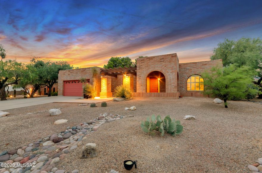 Striking Burnt Adobe home! A superbly maintained Tucson property on large lot with mountain views!  North facing backyard! Inviting pebble tec pool, private walled yard w/professional landscaping.  New Solid vinyl flooring in most of the house.   New windows throughout!  Kitchen offers Pecan cabinets, tile countertops & newer appliances.  Island is great for entertaining and offers room for barstools. Beautiful plantation shutters.
Family room off kitchen with larger slider out to covered patio. Beehive fireplace. Pecan cabinets in bathrooms as well.  Double vanities in both baths & neutral cultured marble counters & surrounds.  4 bedrooms w/split owners suite. Owners suite has a great walk in closet & slider to patio.  Well maintained from top to bottom!  See agent remarks for more.