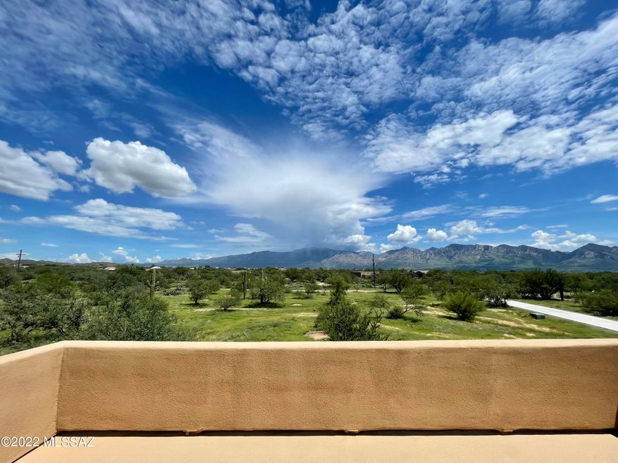 Seller offers $15,000 concessions in lieu of carpet replacement/new flooring. What an amazing difference new floors will make! 2017 Custom built 5,179 sqft home (2 primary suites, 1 downstairs 1 upstairs,) with panoramic views from over 4 acres with a 5,000 sqft steel-frame utility building. Horse property with a strong connection to the Sonoran desert and the surrounding mountains, on a gated private road with only 7 other homes, bordering Oro Valley. With an 850 feet deep Water well, 2 septic tanks -all you need is solar to ''Go off grid''! NO HOA!   This property is a paradise for car collectors/ contractors/ builders/ RV owners or anyone in need of a workshop/storage of a 5,000 square feet ancillary building. It has 2 wide stance car lifts and 2 RV hookups, bathroom, its own septic,400 AMP panel and so much more.  This Energy certified home custom built by owner/builder less than 5 years ago with pride of ownership and attention to detail too many to mention here  please see list attached.
Inside the home the unique steel print porcelain tiles create a harmonious, elegant flow around the downstairs living areas. Connected to the great room is the impressive chef's kitchen.  Enjoy modern maple cabinetry with marble design granite slabs, energy star qualified stainless high-end appliances and deep-basin stainless farmhouse sink.  Oversized island is the focus point of the living room.  Two x 6 burner (yes, 12 burners total!) gas ranges set-up with commercial stainless vent hood and granite slab backsplash with glass tile surround.  
The spacious owners' suite downstairs has access to the back patio with a new hot tub to enjoy the sparkling night sky and moon over the Catalina Mountain Range. The walk in closet has a connecting laundry shoot area with 2 wood baskets to make that chore easy, just to mention a few special features this home has.
The luxurious granite stones and maple cabinets and designer touches of the kitchen harmoniously create a flow all around the home with the same finishes used in all of the bathrooms and the huge laundry room.
The additional room that is currently used as an office, was originally designed as a wine room. The spacious loft upstairs offers endless possibilities for a fun game room and family room with breathtaking views of the surrounding mountains. The second primary Suite upstairs has a guest quarter/in law suite potential (hot/cold water piping and drain all set up). There are 2 additional spacious bedrooms  and a full bathroom upstairs, and the loft was designed for the option to easily add a 5th bedroom if needed.
The huge balcony from the loft is where you can enjoy the Tucson city lights sparkling at night, and during the day the Tortolita and Catalina Mountain views provide a beautiful outdoor sitting area to enjoy.
Seller offers $15,000 concessions in lieu of carpet replacement/new flooring.