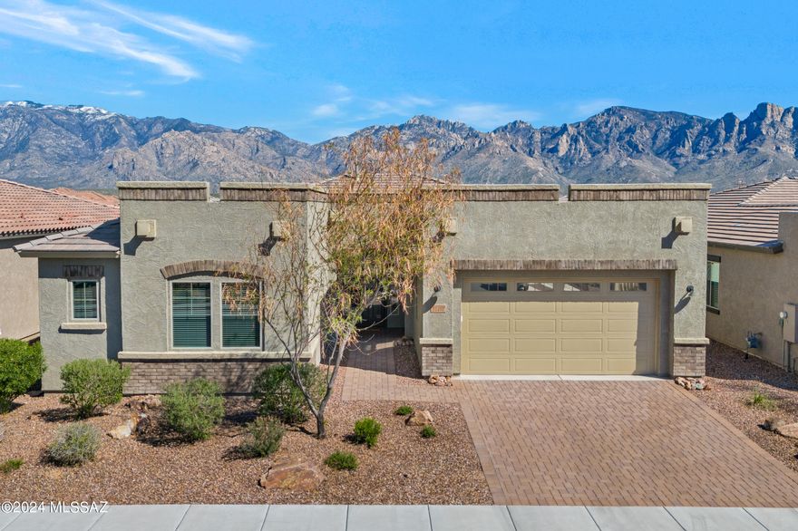 Lovely Patina Model, 3 bedroom + DEN, 3 bathroom, Contemporary home with mountain views in Gated Alterra at Vistoso Trails. High Ceilings, light/bright, open floor plan-great room with Views, kitchen boasts large granite island/counters, upgraded stainless appliances, Walk in pantry, breakfast bar. Porcelain plank tile in main living areas, split bedroom plan with primary bedroom featuring dual sinks, soaking tub, large walk in closet and lovely upgraded shower. Spacious guest bedrooms with a Den that could be a 4th bedroom. Laundry room with sink, 3 car tandem garage with mud room adjacent. Rear yard facing East with Mountain VIEWS, covered patio and just gorgeous. Come take a look-you will love this location!