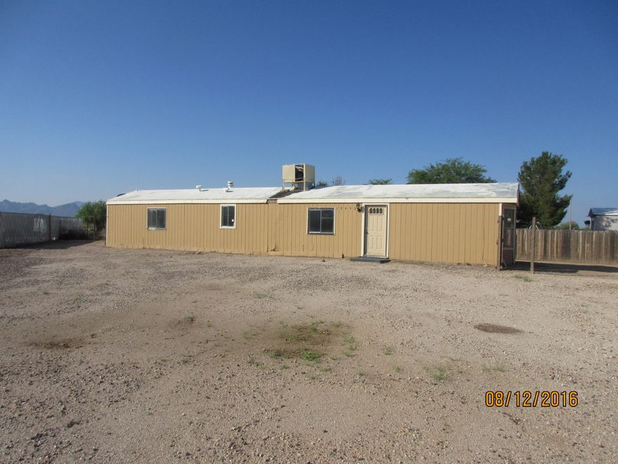 Fix up Manufactured home on large lot.
