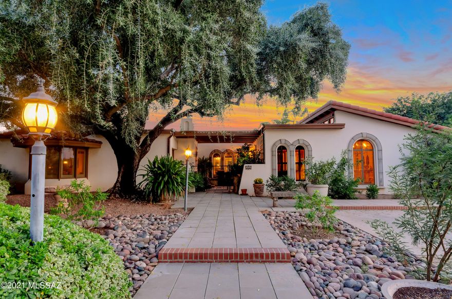 Located in gated Tucson Country Club, this classic Hacienda with high beamed ceilings has Mexican tile floors, fountains, Cantera accents, hand carved doors Waterford Crystal Chandelier & 4 fireplaces. Separate bedroom & bath off of the spacious cooks' kitchen. Private library. Generous primary bedroom with sitting area. Enjoy viewing the Kit Schweitzer designed fountain from the main bath. Jack & Jill bath (shows as 2 baths in the listing) Sparkling pool to cool off in after playing tennis on your personal court. There is a cabana with BBQ, frig. & fireplace to add to your outdoor entertaining & enjoyment.  The game room with a sauna & wet bar opens to the backyard. This estate is solid masonry construction & has custom copper gutters.  Large 3 car garage with extra room workshop & historic gate with lock from a Tombstone jail to the wine cellar. New HVACS!
 
In the 1970's Tucson hosted professional tennis tournaments many of the top players in the world used the court as a practice court.  Players included Rod Laver, John Newcombe, Ken Rosewall and Roy Emerson. They came year after year to practice before the tournament and many parties were hosted for them with food and music in the back yard.