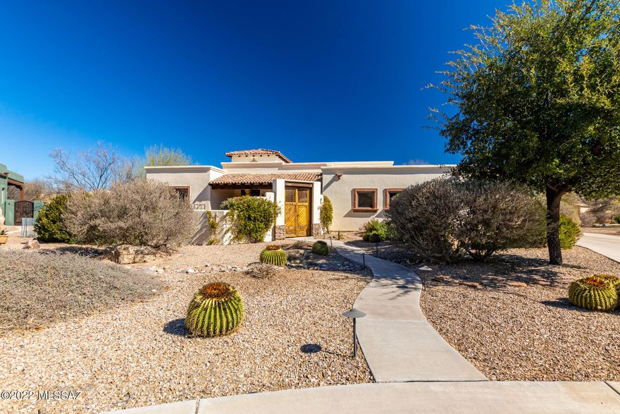A one of a kind 2950 sq.ft Dorn Homes ''Telluride'' Model home, loaded with upgrades, sitting on a private .46 Acre lot in the heart of the Barrio De Tubac Santiago subdivision. 2950 sq/ft, 3 BR, 2.5 bath with large common areas to the front and rear of the property to provide privacy and fabulous Santa Rita and Tumacacori Mountain views. A tastefully tiled entry doorway opens to a great room design & oversized Anderson windows and doors framing the mountain views & large Cantera stone trimmed gas fireplace. Spacious kitchen with large eat in area, dining area, office (w/built in's), and heated/cooled 3rd garage. Large front and back patios with beautiful hardscapes (sandstone, pavers) . Fantastic fire pit in backyard.  Unique floorplan and desired Barrio (back of the cul-d-sac) location