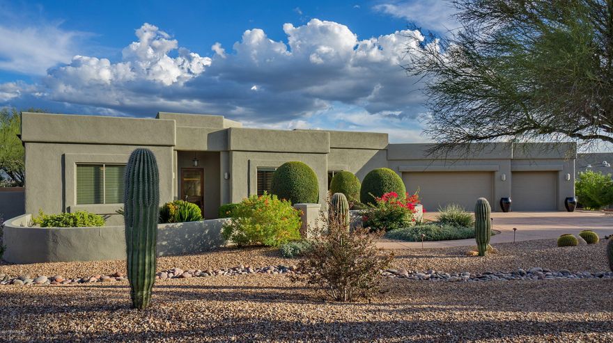 The perfect home!  Not too big (2577 sf), built in 2004 with an open floor plan, high ceilings, quality finishes and landscaped backyard with spectacular mountain VIEWS.  3 bedrooms (or 2 beds +Den)/3 bathrooms. Finishes include alder doors, engineered hardwood & tile flooring, granite counters, cherry cabinets & SS appliances. The great room features stacked stone fireplace, wine cooler and surround sound entertainment center. Great room is open to the kitchen or from 2 sliding glass doors out to the covered patio.  The 1500 sf paver Patio includes fountain, outdoor speakers & built-in BBQ. Views of 4 mountain ranges from the back yard!  You will love the 3-car garage which is extra high and deep. Located near golf, shopping, hiking and biking trails. Highly rated Tanque Verde Schools.