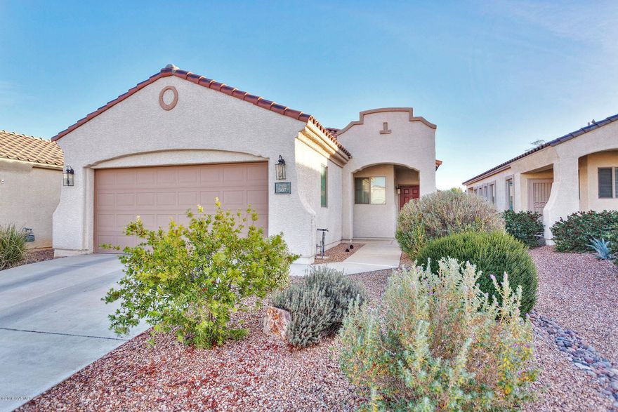Enjoy active adult living in Sonora, a Del Webb 55+ community in the heart of Rancho Sahuarita. This popular Kino model is an 1,189 sq.ft., 2 BR/2 BA detached home. Eat-in kitchen features Corian counters, gas range, pantry closet. Ceramic tile in great room, kitchen and baths, carpet in bedrooms. Spacious master bedroom features bay window w/plantation shutters. Master bath has executive height counter, dual vanity sinks, walk-in shower, and walk-in closet. Fully enclosed backyard with low care landscaping. Enjoy the private amenities exclusively for Sonora residents, including clubhouse, pool, spa, fitness center, library sports court with Pickleball, Bocce Ball and Horseshoes. Also includes full access to the family friendly amenities of Rancho Sahuarita.