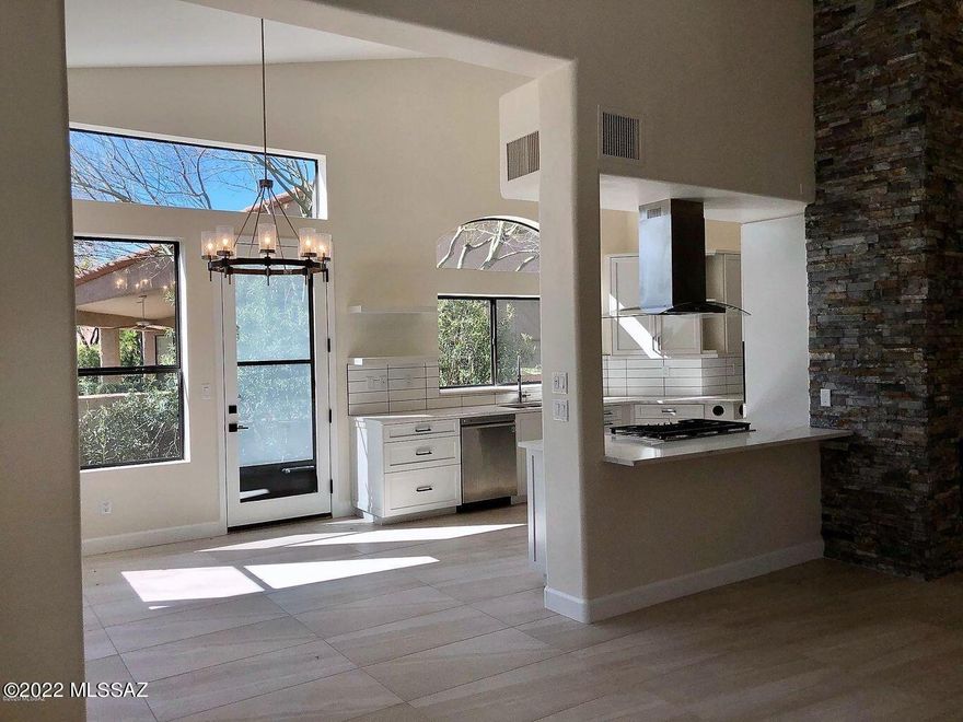 Simply Sublime, Shows like New!  Floor to Ceiling Renovation 2020, beautifully executed with all the top quality design features you'd want in your Ventana CC Golf Villa.   No steps/stairs!  Sleek, Modern Kitchen opens to an Impressive Great Room, new  custom bar & built-ins, offset by a Stacked Stone gas Fireplace.  Expansive Quartz Surfaces, Custom Cabinets and Stunning Tile throughout.  3rd Bedroom with New, Built-in Home Office.  Luxurious Master Bathroom, with an emphasis on Natural Light, features a large Walk-in Shower with Glass Surround & Garden Tub.  Northeast facing Patio offers Privacy and a peek-a-boo Mountain View, complete with New Built-in Gas Grill.  2020 Zoned HVAC & Water Heater.  Over $12,000 in Window Coverings.  One of the best Golf Villas on the market this year.