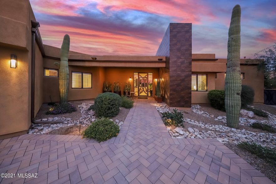 You will find this gorgeous soft contemporary home in the beautiful gated community of Rancho Solados. Set on almost an acre lot, surrounded by the RIcnon and Catalina mountains, you will feel like you are sitting in nature's solitude. As you enter the beautiful grand custom iron door, you are welcomed by large oversized windows, perfectly framing those mountain views! The open floor plan and tall ceilings give this home a spectacular feel. This home features an owners retreat with more amazing views and its own entrance to the backyard living space. The luxurious en-suite has a large walk-in closet, walk in shower w/ 2 shower heads, his and hers sinks as well as a jetted tub. The three large secondary bedrooms each feature their own en-suites and huge walk in closets. The kitchen is a chefs delight! An upgraded six burner stove, built in refrigerator, double ovens and huge walk in pantry will make cooking a breeze! This home has custom Hunter Douglas remote controlled Silhouette covering so the views are not obstructed, but you have the privacy you need when necessary. The front windows are complete with Hunter Douglas 4.5 inch shutters. This backyard retreat will serve you and your family and guests as a secondary living space year round! It's features include oversize heated pool with slide and diving board, hot tub, pickle ball court with dedicated light, in-ground trampoline, luscious landscaping that will make your heart happy year round! Its high end custom outdoor kitchen is an entertainers dream equipped with built in Traegger smoker and Napoleon grill, all covered by a custom alumi-wood pergola. The custom made cactus water feature sits in the flower bed and is the cherry on top of this backyard oasis! Come see for yourself and Welcome Home!
Seller related to agent.