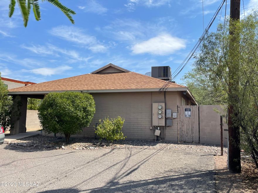 Location, location, location! Amazing opportunity to own this money-making tri-plex, separately metered and walking distance to the U of A. Fully occupied with leases in place until Summer of 2024 and rarely vacant with fast turn over time. Unit #1 is a 1 bedroom 1 bath that has been recently upgraded with tile and granite. Unit #2 is 2 bedrooms, 2 baths with tile in main living areas. Unit #3 is 4 bedrooms, 2 baths with upgraded laminate flooring and a large wrap around yard with a garden. Each unit has its own private patio separated by block wall. These are exceptionally well maintained. You won't be disappointed. All the units come with the existing appliances which includes the washers and dryers located inside each one. Tenants pay electric and gas. Owner pays water, sewer and trash