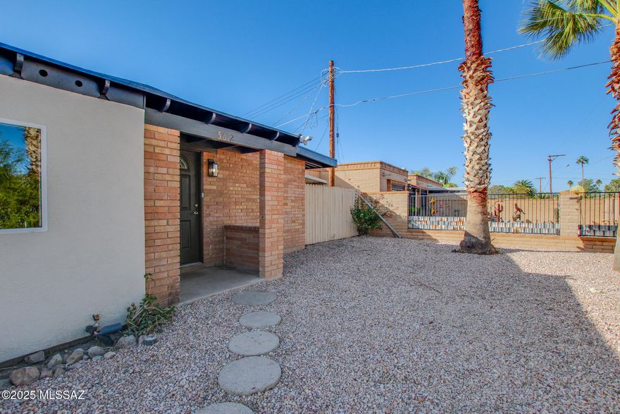 This beautifully remodeled 4-bedroom, 2-bathroom home in central Tucson offers style, functionality, and income potential. The spacious kitchen features brand-new cabinets, a large island, and granite countertops, complemented by porcelain tile flooring—perfect for entertaining. New dual-pane windows enhance energy efficiency and comfort. A versatile bonus room, connected to the living area and kitchen, can be a dining room, office, game room, or playroom, with an adjacent bedroom for added flexibility. The property has ample space to build an ADU for extra income. Great central location—just 6 miles to UA, near Fort Lowell Park, TMC, restaurants, and groceries. No HOA means the freedom to park your RV or toys. Don't miss this incredible opportunity!