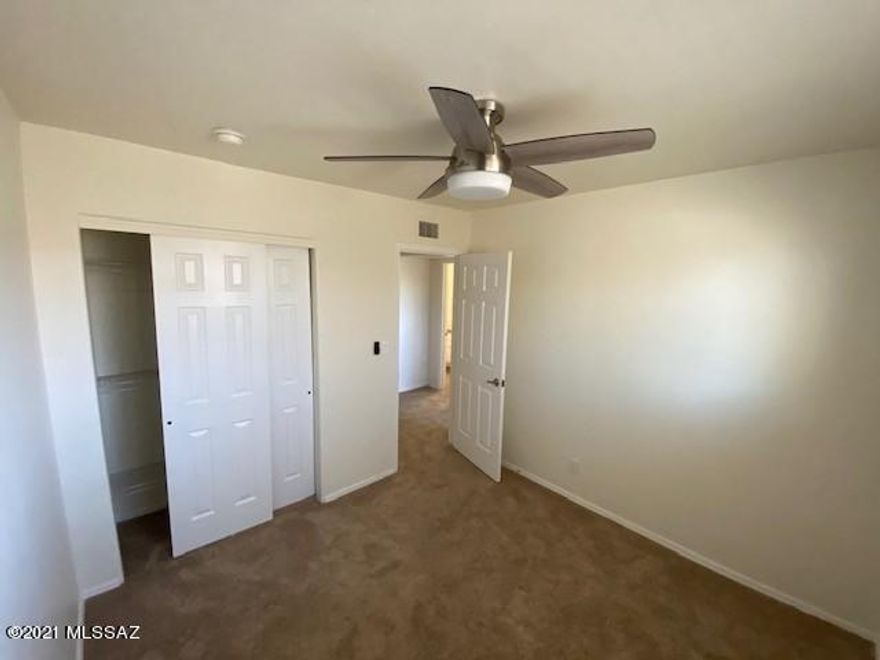 Newly remodeled Two Story, 3 BR/2BA Town home is ready for your move in. Living room, Kitchen, dining area and half bath downstairs. Upstairs, each BR has a lighted ceiling fan and dual pane windows. Newer carpet, new SS appliances, W/D, AC, & security front door. Patio French doors to your private, secluded backyard. A quiet, central location with community rec center and community pool. Plenty of parking on/off street including one covered space. Convenient shopping, DMAFB, and UA.  Tenant will be billed additional $100/month for water/sewer. Owner is Licensed Real Estate Agent in Arizona.