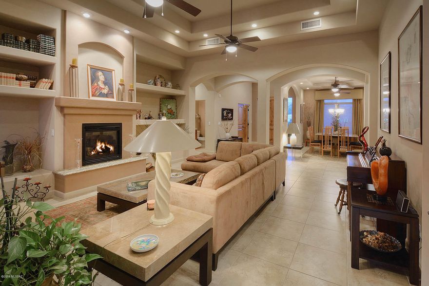 Outstanding 2006 southwestern high on a hill in the Catalina Foothills with unobstructed, sweeping Catalina and Rincon Mtn. views, 3,681 sq. ft. 4 bedrooms and office.  Located on a one acre lot in Tucson's near foothills on a quiet street away from traffic noise, courtyard entry leads to living room/dining room with dramatic high ceilings and windows with lots of light, neutral flooring, knotty alder doors throughout, gourmet kitchen with granite counters, SS appliances, open flowing split bedroom floor plan, fireplaces in living and family rooms, quality construction including post tension slab.  3 car garage, wonderful rear yard with covered porch, paver walkways, hot tub, outdoor kitchen, putting green and so much more.  See to appreciate.