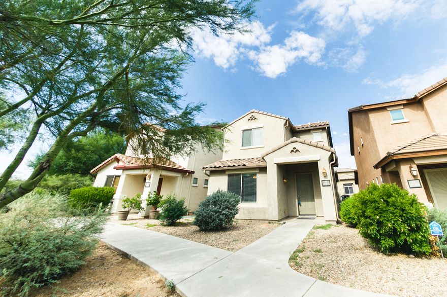 Here is your chance to get into the highly desirable Sierra Morado neighborhood and Vail School District!  This gorgeous 2 bed, 2.5 bath model home is within walking distance of the beach entry community pool, community center, multiple parks, and a bike/running path that weaves throughout the community.  The first floor opens into a large family room with the kitchen overlooking.   The master bedroom with ensuite bathroom and walk-in closet give you space to relax.  One more bedroom and a full size bath complete the second floor.  Front of home opens to a generously sized open space with breathtaking views of the Rincon Mountains!  This home won't last long, so place your offer today!