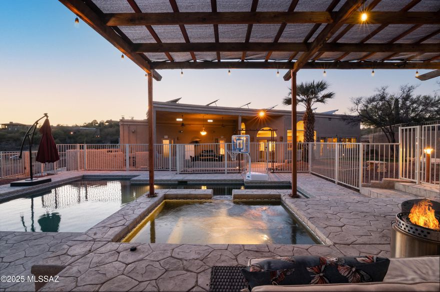 Sprawling Custom Home in the Heart of Oro Valley with Endless Possibilities! Nestled on over an acre of prime Oro Valley land, this stunning home offers spacious living and breathtaking surroundings. Designed for both comfort and entertaining, this home boasts an open floor plan, soaring vaulted ceilings, and abundant natural light. The kitchen features a breakfast bar, prep sink, built-in cabinetry, and seamless flow into the dining area and great room. The great room is an entertainer's dream, showcasing a stacked stone fireplace, a wet bar with beverage refrigerators, and two grand picture windows framing the serene desert landscape. This home offers two primary suites, each with private entrances and spacious walk-in closets. One suite includes an additional attached roomperfect for a home office, nursery, or second walk-in closet. This home truly has endless potential to become your perfect dream residence. Venture outside into your private desert oasis, where an inviting sparkling pool and spa await. Enjoy upper and lower patios, complete with an outdoor fireplace, built-in BBQ area, and seating space for entertaining under the stars. The side yard features a double gate, providing easy access for additional storage or recreational vehicles. Enjoy city views to the south and glimpses of the Catalina Mountains to the east, all while being minutes away from shopping, dining, golf courses, and top-rated schools. This is a must-see home with unlimited possibilities
