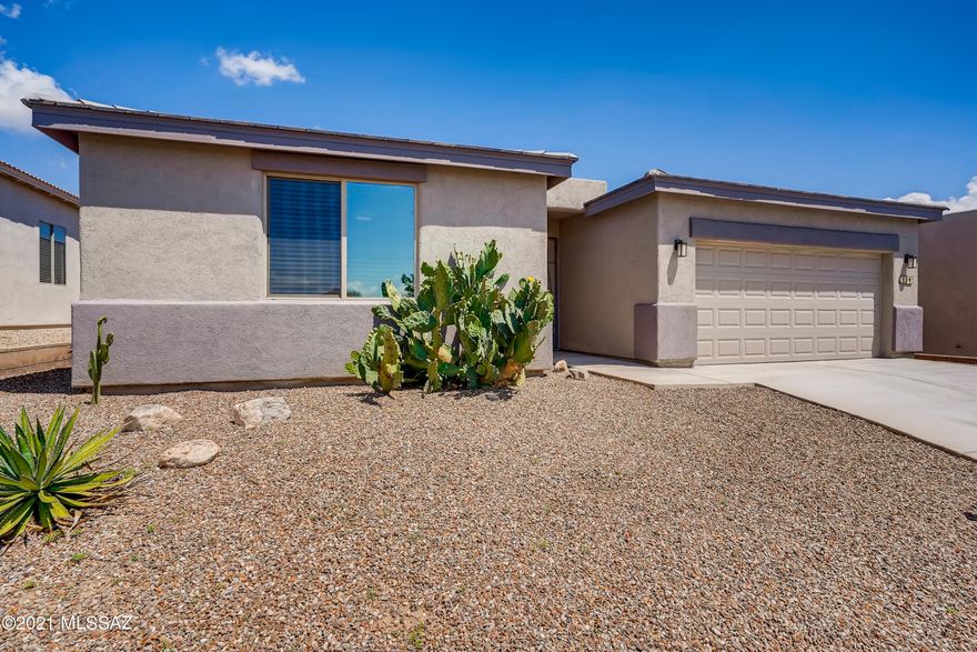 You will fall in love with this 3 bedroom, 2 bathroom open concept home that lets natural light settle in all the right places. Upon entry, admire the contemporary finishes complete with sleek flooring and vaulted ceilings. Prepare a delicious meal in the pristine kitchen that offers a breakfast bar, stainless steel appliances, granite countertops, and space to store all of your essentials in the pantry. The primary bedroom has access to the covered back patio outfitted with an en suite, including a dual sink vanity, a floor-to-ceiling tiled shower, and a spacious closet. This home provides a central location less than 5 minutes to dining and Green Valley shopping.