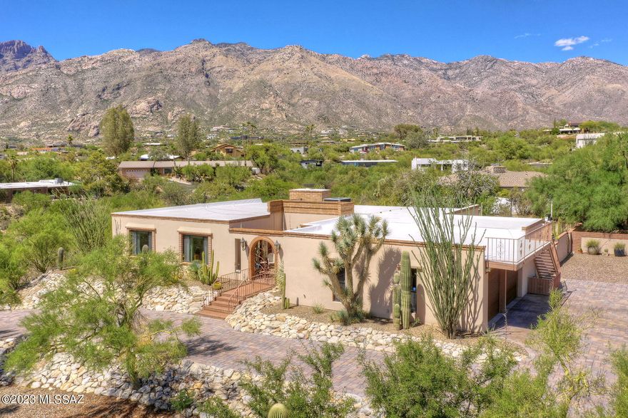 Welcome to your dream home, perched gracefully atop a hill on a 1-acre lot, offering breathtaking panoramic views of the Catalinas.
Step inside to discover a renovated kitchen that boasts custom cabinets with granite countertops, exuding elegance and functionality, providing ample storage for all your cooking needs.  
The living room fireplace has a Venetian paint finish, French doors to the outside garden and mountain views. A media room plus 3 bedrooms and 2 baths complete the home of 2768 square feet of comfortable living. 
Outside, your private oasis awaits sitting around the backyard fire pit, basking in the awe-inspiring views of the mountains. The backyard lighting creates an ethereal atmosphere. Xeriscape landscaping throughout property. For those with a green thumb, a delightful surprise awaits in the form of a flourishing herb garden. 
This exquisite home on a hill offers not just a place to live, but an extraordinary lifestyle, where you can immerse yourself in the beauty of nature, enjoy modern comforts, and relish in the serenity of your surroundings. HOA includes community pool, tennis courts.