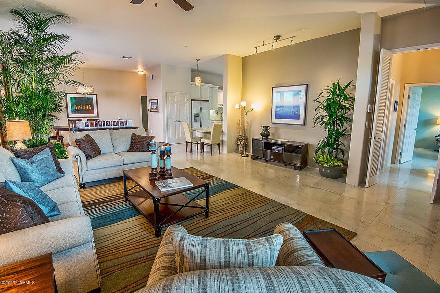 The last new home by the builder of Armory Park del Sol. NET ZERO Energy home has open, split floorplan, 10' high ceilings, huge master bedroom with ensuite and 2 bedroom full bath guest suite. French doors w/sidelights, Energystar appliances, Thermal mass storage construction guarantees low TEP bill. ($20.00 per month!)Recycled, sustainable materials, premium finishes, gourmet kitchen, Handicap accessibility. Alarm, central vacuum, home sprinkler system, Electric car charger, water harvesting cistern, Solar hot water heater, tankless water heater. 3 car garage, 3rd bay has 1/2 bath & mini split for heating & cooling. Gladiator storage system in garage included in sale. Owner is a Licensed RE Broker in AZ.