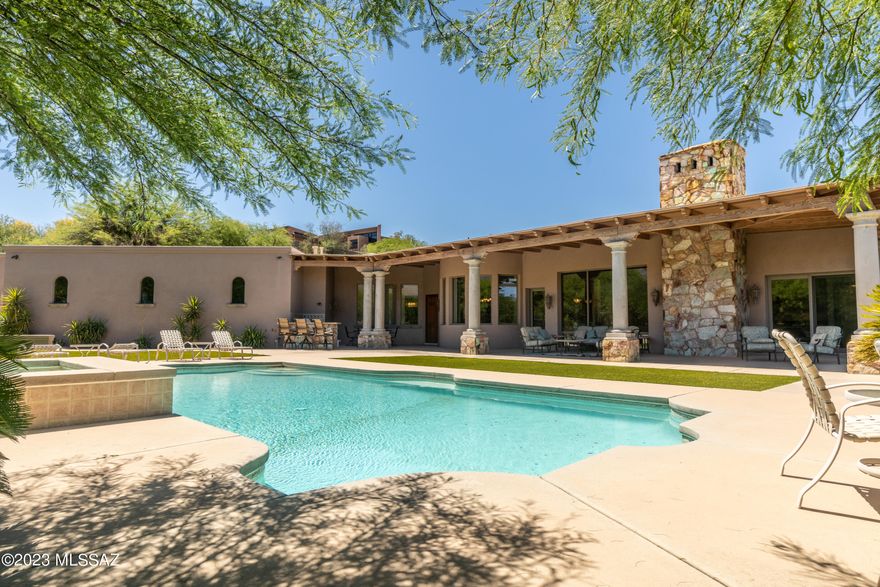 LA PALOMA! Highly Sought After, Guard Gated Community of La Paloma Estates. A Truly Remarkable Tuscan Designed Custom Home by Renowned Architect Kevin Howard. The Home is Well Oriented to Take Advantage of the Spectacular Catalina Mountain Views and Colorful Sunsets.  Inviting Entrance through the Grand Foyer Reveals Timeless Elegance. Magnificent Interior Features: Exquisite Great Room with High Ceilings, Porcelain Tile Floors, Schist Rock Fireplaces, Wood Beam Ceilings, Lovely Arches and Windows, Classic Tuscan Concrete Columns and Sophisticated Finishes. Owner's Retreat with a Discrete Patio, Sensational Shower, Soaking Tub and Roomy Walk-in Closet. Chefs Kitchen Boasts an Expansive Island for Gathering or Prepping. Stainless Steel Appliances. Generously Proportioned Rooms, Paired CONT with a Thoughtful Floor Plan is Ideal for Entertaining and Casual Living. Stay Fit in Your Own Work Out Room. Lounge by the Sparking Pool that Serves as the Centerpiece of the Backyard. Lush Vegetation Creates a Serene Oasis. Fabulous Full Length Back Patio, Outdoor Kitchen, Fireplace and Fountain. Spacious Outdoor Living Environment Exemplifies Resort Style Living. Minutes from Fine Dining and Upscale Shopping at La Encantada, you are in the Heart of the Foothills Corridor with Art Galleries, Financial Services, Catalina Foothills District 16 Schools, Numerous Hiking Trails, and Climbing Spots. Homes in La Paloma Estates Are Not Available for Sale Often. DO NOT MISS THIS OPPORTUNITY. COME SEE THIS GEM TODAY!
