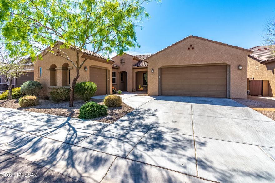 Great open floor plan in wonderful community, close to many amenities. This beautiful home offers three bedrooms plus den and two and one half baths. Enjoy extraordinary sunsets views from the professionally landscaped backyard which backs to a wash area. Large rear patio with electric sun shade makes this the perfect area for entertaining. New carpet in all bedrooms and fresh paint throughout. Large laundry room with hook up for utility sink. Fountain in rear yard does not convey.