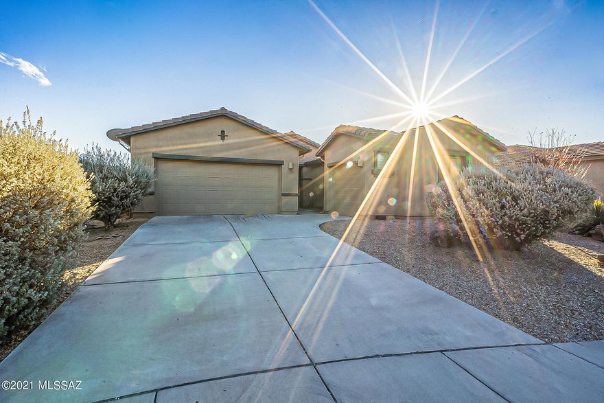 Welcome Home to this charming 3 bedroom, 2 bath house located in the desirable Madera Highlands Community. This home features a separate 3rd car garage, no immediate rear neighbors and OWNED solar panels.This house has a freshly painted exterior and new carpet installed throughout. Upon entrance you are greeted by a large great room and a beautiful open concept kitchen complete with granite countertops and tile backsplash. Your large backyard has an extended covered patio with decorative pavers. Don't wait. This won't last long.