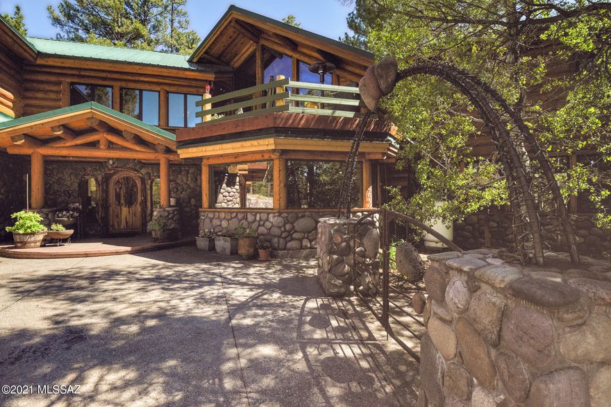 Welcome to Paradise at 7,000 Ft. The Estate at North Ranch boasts over 12 Acres in a gated private community with only 3 other homes, surrounded by National Forest Service. This rare property features all paved, easy access, just 14 minutes from downtown Flagstaff. This heritage log homestead at over 6,000 sq. ft. with 5 bedrooms, 4.5 baths, 3 car garage plus a workshop has room for everyone and all your toys. Entertain your family and friends in the spacious upgraded kitchen, on one of the multiple decks or patio's or hang out at the bar or one of the two game rooms. Bright and open with walls of windows and tons of special custom stone and log work. The extensive outdoor space at this property is simply stunning with a deep water well, two Koi ponds with a stream between them makes for a wonderful water feature, huge fenced yard, raised bed garden and there's even a tree house. Schedule your private showing today-available to tour on Thursdays or Sundays.