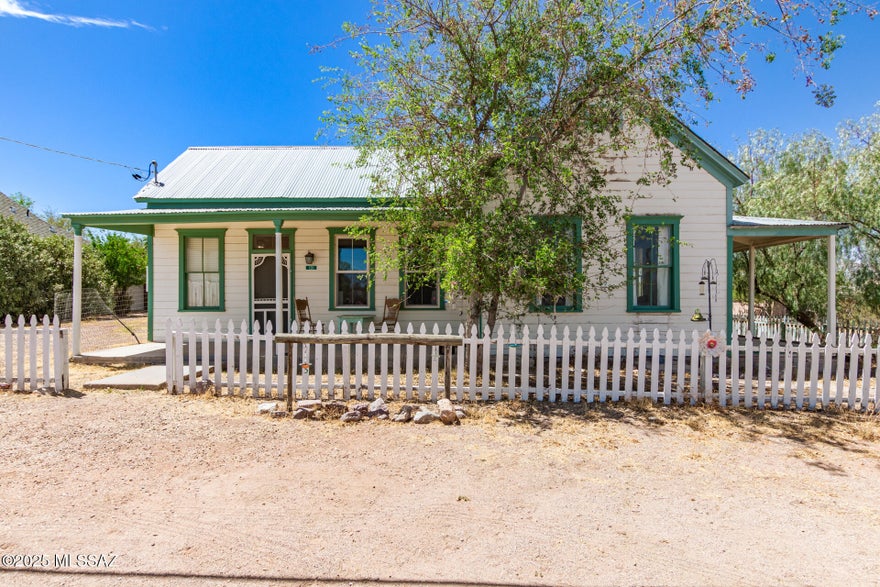 Rare slice of Old West history is now available in Tombstone! This charming single-level home is situated on a large, fully fenced corner lot. The bright & light interior features a designer palette, layered crown molding, and carpet & wood-look flooring in all the right places. You'll love the welcoming living room and the formal dining room w/fireplace! The sizable kitchen has a built-in elec range, pendant lighting, and pull-out drawers. Two oversized main bedrooms with its own bathroom! There is also a bonus room ideal for a workshop, storage, or hobby area. If you want to relax while enjoying the neighborhood's tranquility, the cozy front porch and side & back covered patios await you! The spacious backyard provides plenty of room for your creative ideas. Don't miss this opportunity!