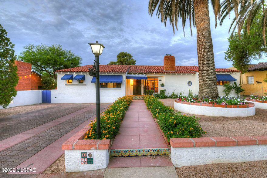 .Beautiful Bungalow near the Arizona inn.  This lovingly cared for and maintained home retains its original charm with its hardwood floors, vintage tiled bathrooms, master has two room suite w/two bathrooms. Hall bath was remodeled to reflect the time period, split 3rd bedroom has rec room w/bar ensuite bath, kitchen, w/ corner window, pantry & mudroom.  Arizona room has original integral colored concrete flrs.  Backyard has covered patio, fountain, brick pavers, fruit trees, garden beds, laundry room off large 2 car garage.  Walk to AZ Inn, Banner Hospital, the Modern Street car, UArizona and more!