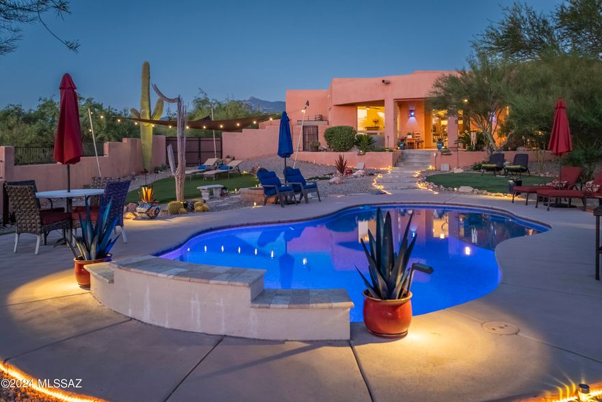 Welcome to The Sanctuary in Coyote Creek, where privacy abounds. This resort-style, custom home is located in an exquisite gated community that features an equestrian center, riding trails, and a recreation center only minutes away from town. Surround yourself in the serenity of a gorgeous desert landscape with panoramic mountain views and picturesque painted skies from the front courtyard, the living spaces, or the masterfully designed backyard oasis. Step into a home with soaring ceilings, stunning Southwestern design elements, handmade shiplap walls, and walls of wood-framed windows that create the feeling of being connected to the outdoors. The oversized kitchen offers so much with a plethora of knotty alder cabinets, expansive granite counters, stainless steel appliances, a wine fridge, and mesmerizing views from the window. Relax in the Owner's Suite with even more views, a spa-like shower, and direct access to the back patio, pool and spa. Need storage? There is a large storage space above the laundry room, and the 3-car garage fits oversized trucks and is outfitted with plenty of cabinets as well as workshop space. Warm up by the wood-burning fire-pit outside, or cool off inside where the HVAC system was recently replaced. Newer water softening system, hot tub, kitchen fridge, laundry machines and deep freezer all convey with acceptable offer. Come. See. Stay!