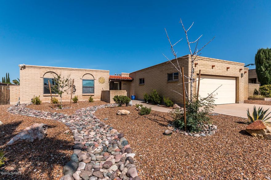 Well built slump block home in nice & convenient area of town! Beautifully landscaped front yard, 2.5 car garage with workshop, large living and family rooms, breakfast bar, laundry room, & the formal dining area are all great spaces in this home.  Walk down a wide hallway to 3 bedrooms & 2 baths. Nice size master bedroom has great walk-in closet, and mountain views from the window!  Lush backyard has green grass, grapefruit tree(pink) & a separated pool area, perfect for entertaining! This house is move-in ready so come see it today!