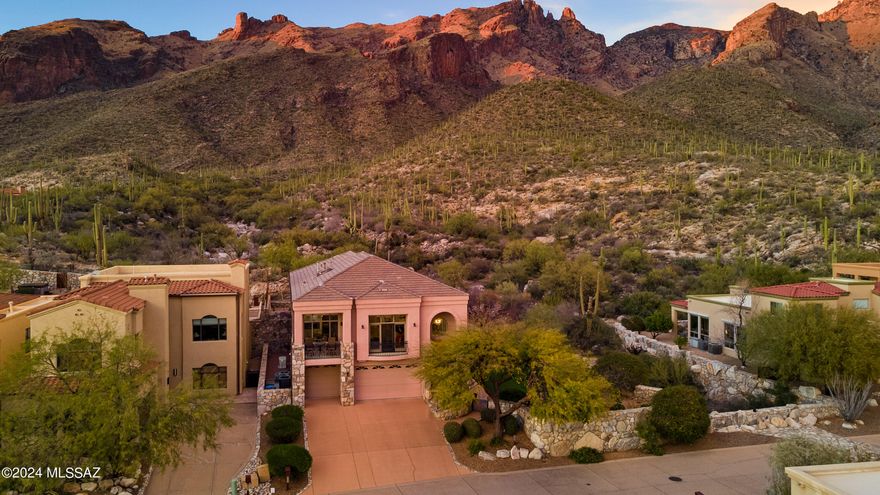 Highly Sought after Catalina Foothills Gated Community, The Summit at Finger Rock. Adjacent to the Breathtaking Coronado National Forest and just Steps away from the renowned Finger Rock Trailhead.  This Soft Contemporary Home 4 bedrooms 3.5 Baths  with Soaring Ceiling height  flanked with Walls of windows that accentuate the never ending views both Mountains and City .
Multiple Balconies allow for relaxing and enjoying the the incredible special space  with so many options to take in the beauty of the natural desert that surrounds you .
The Flexible floor plan creates numerous options for your living enjoyment. The lower level could be a guest quarters with a Master living area or a great place for family gatherings & movie nights. Many recent upgrades and additions to this stunning home.  A few of the recent improvements to the home include a entire home generator to protect you from those intermittent power losses during our beautiful monsoons, 4 sets of Bulldog security doors & screens , 2 New HVAC systems, a major kitchen remodel ,
adding a hot tub in a perfect location to enjoy both city & mountain views to name just a few.
 Please see upgrade list in documents for full list .