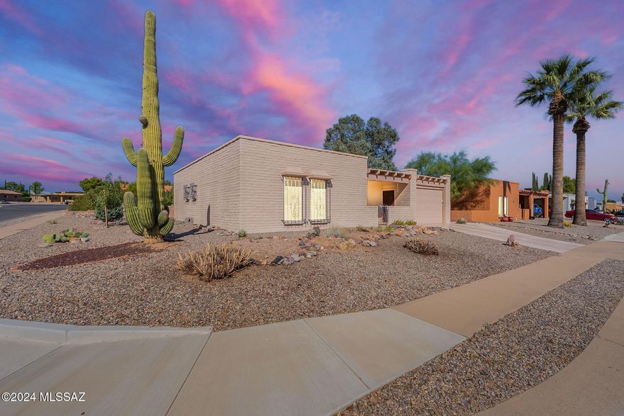 Just bring your suitcase and move in to your AMAZING desert oasis! With mountain views in the front and back of the home the backyard has amazing mature landscaping all throughout. The front porch is perfect for seeing the beautiful Santa Rita Mountains. The kitchen has been updated with all new appliances and granite countertops. The guest bathroom has been wonderfully updated. There is two large spacious living areas perfect for entertaining and beautiful ceramic tile throughout! The laundry room has tons of shelving and storage! Also the once carport has been turned into a garage. Come and see this GEM of a home in Green Valley today!!
